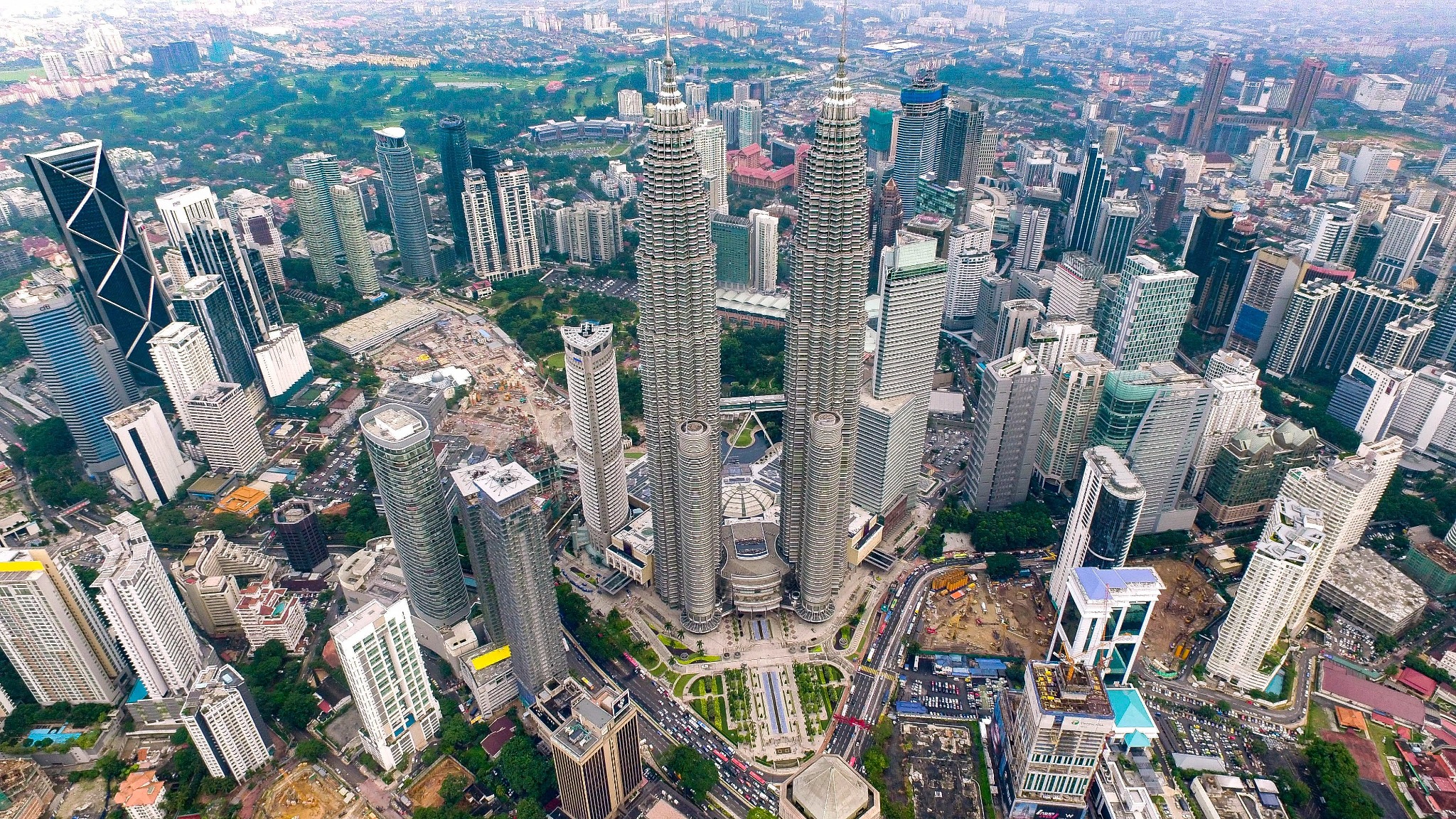 Aerial view of Kuala Lumpur centered on the Petronas Twin Towers