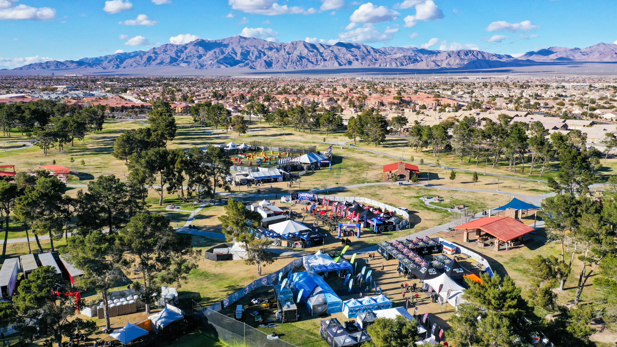 Aerial view of a large outdoor event arranged across a Las Vegas park